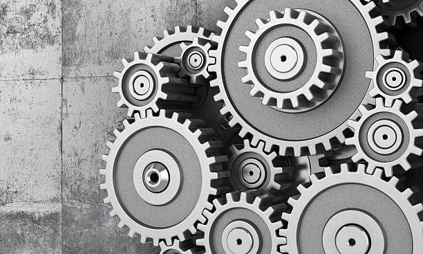 Concept of work. Mechanism of gears on a concrette background. 3d illustration